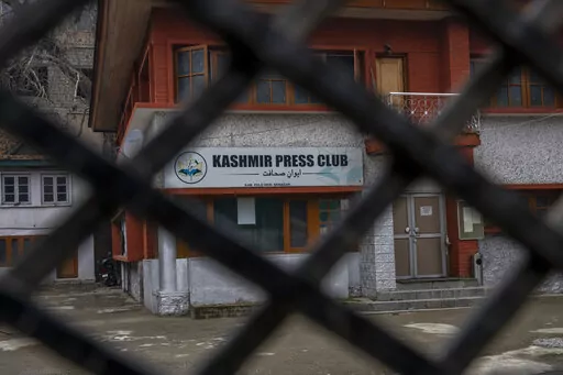 Kashmir Press Club building is pictured through a closed gate after it was sealed by authorities in Srinagar, Indian controlled Kashmir, Tuesday, Jan. 18, 2022. Last week, a few journalists supportive of the Indian government, with assistance from armed police, took control of the region’s only independent press club. Authorities shut it down a day later, drawing sharp criticism from journalist bodies. Reporters Without Borders called it an “undeclared coup” and said the region is “stead