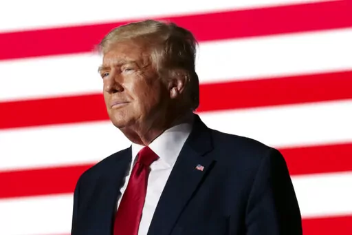 Former President Donald Trump listens to applause from the crowd as he steps up to the podium at a rally Friday, Sept. 23, 2022, in Wilmington, N.C. Lawyers for former President Donald Trump asked the U.S. Supreme Court on Tuesday, Oct. 4, to step into the legal fight over the classified documents seized during an FBI search of his Florida estate. (AP Photo/Chris Seward, File)
