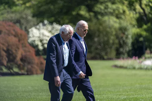 President Joe Biden, right, and Sen. Bernie Sanders, I-Vt., walk from Marine One upon arrival on the South Lawn of the White House, Monday, April 22, 2024, in Washington.(AP Photo/Alex Brandon)