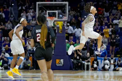 LSU guards Jailin Cherry, right, and Khayla Pointer, left, react in the second half of a women's college basketball game against Jackson State in the first round of the NCAA tournament, Saturday, March 19, 2022, in Baton Rouge, La. (AP Photo/Matthew Hinton)