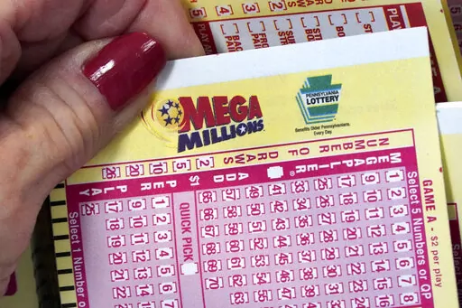 A Mega Millions entry card is displayed at the Cranberry Super Mini Mart in Cranberry, Pa., Thursday, Jan. 12, 2023. On Friday, Jan. 13, The Associated Press reported on stories circulating online incorrectly claiming the IRS would collect nearly $850 million in taxes from a more-than $1 billion Mega Millions jackpot. (AP Photo/Gene J. Puskar, File)