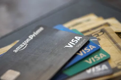 This Aug. 11, 2019 file photo shows credit cards in New Orleans. Inflation has made the cash prices of flights and hotel stays skyrocket this year, but it’s having a surprising effect on a different currency — your airline miles and hotel points. Across the board, your airline miles and hotel points are actually worth more than last year, which is unusual because points and miles generally devalue over time. However, this year’s increased value of points and miles isn’t enough to keep pa