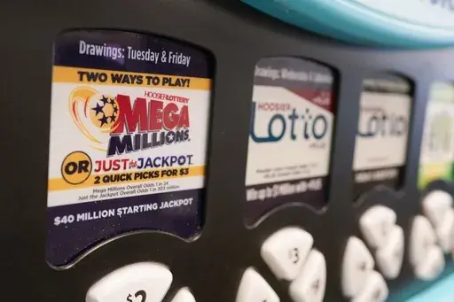 A Mega Millions logo is displayed on a vending machine at the Hoosier Lottery booth at the Indiana State Fair, Thursday, Aug. 3, 2023, in Indianapolis. (AP Photo/Darron Cummings, File)