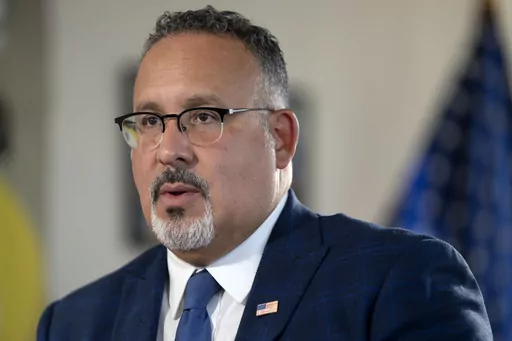 Education Secretary Miguel Cardona speaks during an interview, Sept. 20, 2023, in Washington. The U.S. Education Department says it discovered a calculation error in hundreds of thousands of student financial aid applications sent to colleges this month and will need to reprocess them, a blunder that follows a series of others and threatens further delays to this year's college applications. Senate Republicans are requesting a hearing with Cardona to discuss their “serious concerns” about th
