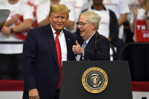 President Donald Trump, left, and Senate Majority Leader Mitch McConnell of Ky., greet each other during a campaign rally in Lexington, Ky., Nov. 4, 2019. McConnell is the highest ranking Republican in Congress who has yet to endorse Donald Trump's bid to return to the White House. But that's potentially about to change. McConnell's political team and Trump's campaign have been in talks over a possible endorsement and a strategy to unite Republicans on the party's ticket for the November electio