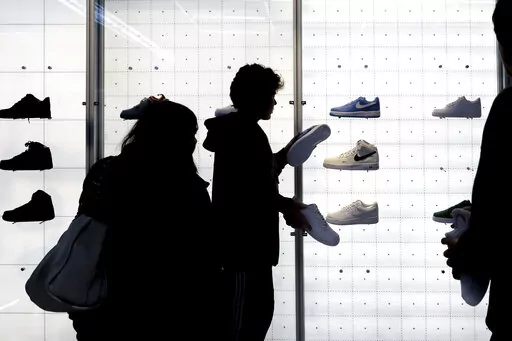 People shop for shoes in a Nike store on , Nov. 25, 2022, in New York. “Buy now, pay later” services like Affirm, Afterpay and Klarna can sometimes provide a cheaper, more accessible version of credit. These services essentially provide customers an alternative way to pay for purchases over time without going into credit card debt or taking out a traditional personal loan. Travel purchases, such as airfare and vacation rentals, are the fastest-growing segment for buy now, pay later services.