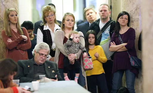 Parents with their children and medical professionals listen to testimony from people who want Mississippi to allow a religious exemption from the vaccination requirements for school attendance, during a legislative committee meeting on Jan. 24, 2018, at the Capitol in Jackson, Miss. Under an order from a federal judge, the Mississippi State Department of Health is publishing information Saturday, July 15, 2023, about how people can apply for religious exemptions from childhood vaccinations. (AP