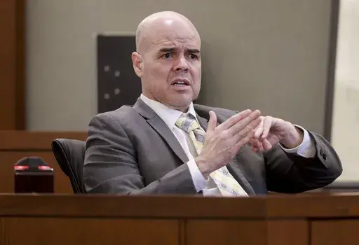 Robert Telles shows how he cut his finger while speaking to the jury from the witness stand on the eighth day of his murder trial at the Regional Justice Center in Las Vegas Wednesday, August 21, 2024. Telles, a former Clark County public administrator, is charged in the murder of Las Vegas Review-Journal investigative journalist Jeff German. (K.M. Cannon/Las Vegas Review-Journal via AP)
