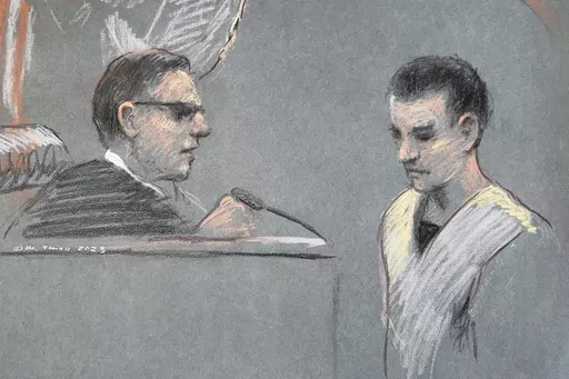 This artist depiction shows Massachusetts Air National Guardsman Jack Teixeira, right, appearing in U.S. District Court in Boston, April 14, 2023. Prosecutors say that superiors of Teixeira, charged with leaking highly classified military documents, had raised concerns internally on multiple occasions about his handling or viewing of classified information. (Margaret Small via AP, File)
