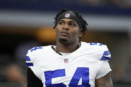 Dallas Cowboys defensive end Sam Williams warms up before a preseason NFL football game against the Jacksonville Jaguars in Arlington, Texas, Aug. 12, 2022. Williams was arrested on charges of possession of a controlled substance and unlawful carrying of a weapon, police said Wednesday, Aug. 23, 2023. (AP Photo/Tony Gutierrez, File)