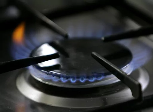In this Jan. 11, 2006, file photo, a gas-lit flame burns on a natural gas stove. A federal appeals court on Monday, April, 17, 2023, overturned Berkeley, California's first-in-the-nation ban on natural gas in new construction, agreeing with restaurant owners who argued the city bypassed federal energy regulations when it approved the ordinance. (AP Photo/Thomas Kienzle, File)