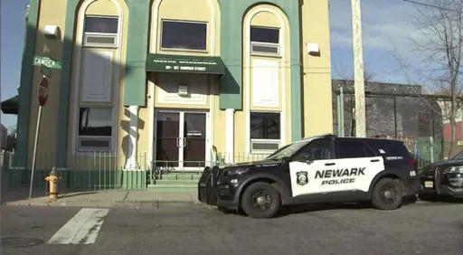 A Newark Police vehicle is parked outside the Masjid-Muhammad-Newark Mosque in Newark, N.J. on Wednesday, Jan. 3, 2024. A imam was shot and critically wounded early Wednesday morning outside the mosque as officers worked to identify and arrest the shooter. The victim was taken to nearby University Hospital and is in critical condition, authorities said. (WABC via AP)
