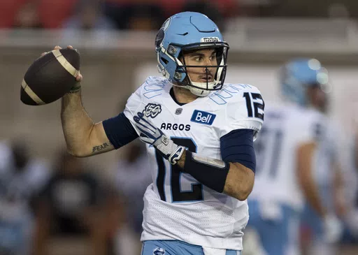 Toronto Argonauts quarterback Chad Kelly (12) throws against the Montreal Alouettes during the first half of a Canadian Football League game in Montreal, Friday, Sept. 15, 2023. The CFL suspended Toronto Argonauts quarterback Chad Kelly for at least nine regular-season games Tuesday, May 7, 2024, following its investigation into a lawsuit filed by a former strength and conditioning coach against both the player and club.(Christinne Muschi/The Canadian Press via AP, File)