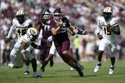 Texas A&M quarterback Conner Weigman (15) runs for a first down against Missouri during the first half of an NCAA college football game Saturday, Oct. 5, 2024, in College Station, Texas. (AP Photo/Eric Gay)