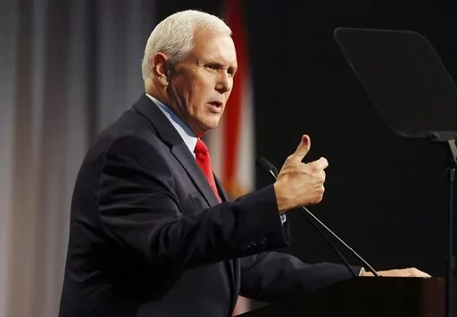 CORRECTS DATELINE TO LAKE BUENA VISTA, NOT ORLANDO - Former Vice President Mike Pence speaks at the Florida chapter of the Federalist Society's annual meeting at Disney's Yacht Club resort in Walt Disney World on Friday, Feb. 4, 2022, in Lake Buena Vista, Fla. Pence, on Friday, directly rebutted Donald Trump's false claims that Pence somehow could have overturned the results of the 2020 election, saying that the former president was simply “wrong.”  (Stephen M. Dowell/Lake Buena Vista Sentin