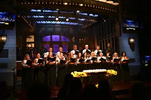 This photo provided by NBC shows Ukrainian Chorus Dumka of New York performing "Prayer for Ukraine" during the opening of “Saturday Night Live” on Saturday, Feb. 26, 2022. (Will Heath/NBC via AP)