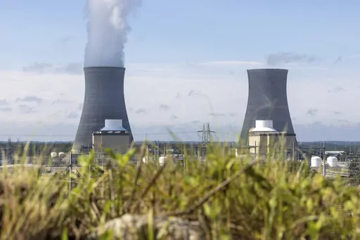 Unit 3 of the Vogtle nuclear plant generates electricity while Unit 4 (right) remains under construction on Monday, July 31, 2023, in Waynesboro, Ga. Georgia Power Co. announced Friday, Oct. 6, 2023 that it would pay $413 million to co-owner Oglethorpe Power Co. to settle a lawsuit over cost overruns at the nuclear reactors. (Arvin Temkar/Atlanta Journal-Constitution via AP)
