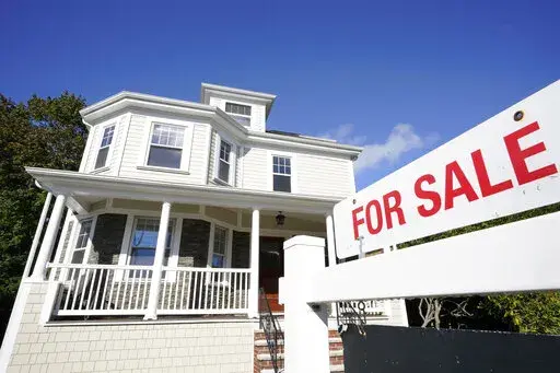 A for sale sign stands in front of a house, on Oct. 6, 2020, in Westwood, Mass. Average long-term U.S. mortgage rates jumped back up ahead of next week’s Federal Reserve meeting where it’s expected to announce another increase to its main borrowing rate. Mortgage buyer Freddie Mac reported Thursday, June 9, 2022, that the 30-year rate jumped to 5.23% this week from 5.09% last week. (AP Photo/Steven Senne, File)