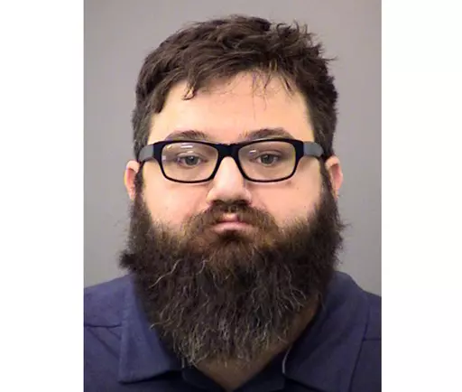 This booking photo provided by the Indianapolis Metropolitan Police Department shows Dustin Passarelli, who was charged in the road rage shooting death of a Muslim man. The Indiana man has been convicted of murder Wednesday, May 17, 2023, in the road rage shooting death of a Muslim man who witnesses said he made ethnic and religious insults against, including yelling “go back to your country,” before the shooting. (Indianapolis Metropolitan Police Department via AP, File)