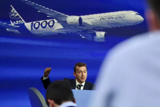 Airbus CEO Guillaume Faury presents the European aerospace giant full year results, Feb. 15, 2024 in Blagnac, near Toulouse, southwestern France. In the latest round of their decades-long battle for dominance in commercial aircraft, Europe's Airbus has established a clear sales lead over Boeing as the American company deals with the fallout from manufacturing troubles and ongoing safety concerns. (AP Photo/Fred Scheiber, File)