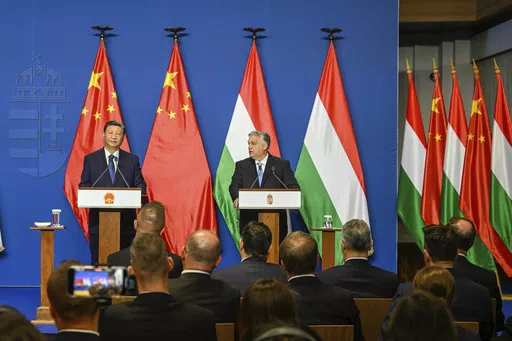 Chinese President Xi Jinping, left, listens during his joint press conference with Hungarian Prime Minister Viktor Orban following their talks at the PM's office, the former Carmelite Monastery, in Budapest, Hungary, Thursday, May 9 2024. Most countries in the European Union are making efforts to “de-risk” their economies from perceived threats posed by China. But Hungary and Serbia have gone in the other direction. They are courting major Chinese investments in the belief that the world’s