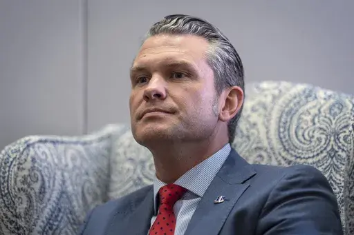 Pete Hegseth, President-elect Donald Trump's nominee to be defense secretary, responds to reporters during a meeting at the Capitol in Washington, Dec. 5, 2024. (AP Photo/J. Scott Applewhite, File)