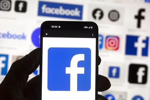 The Facebook logo is seen on a mobile phone, Oct. 14, 2022, in Boston. Social media platforms like Facebook, TikTok and Twitter say they're taking steps to prevent the spread of misinformation about voting and elections ahead of next month's midterm elections. Yet a look at some of the most popular platforms shows baseless claims about election fraud continue to flourish. (AP Photo/Michael Dwyer, File)