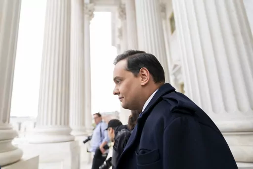 Rep. George Santos, R-N.Y., leaves the Capitol after being expelled from the House of Representatives, Friday, Dec. 1, 2023, in Washington. Santos is out of Congress, but his name is certain to pop up in key congressional races throughout New York next year, with Democrats targeting five seats held by first-term Republicans and looking to associate those incumbents with Santos as often as they can. (AP Photo/Stephanie Scarbrough, File)