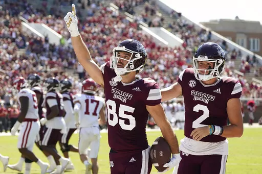 Mississippi State wide receiver Austin Williams (85) celebrates his 10-yard pass reception from quarterback Will Rogers (2) during the first half of an NCAA college football game against Arkansas in Starkville, Miss., Saturday, Oct. 8, 2022. (AP Photo/Rogelio V. Solis)