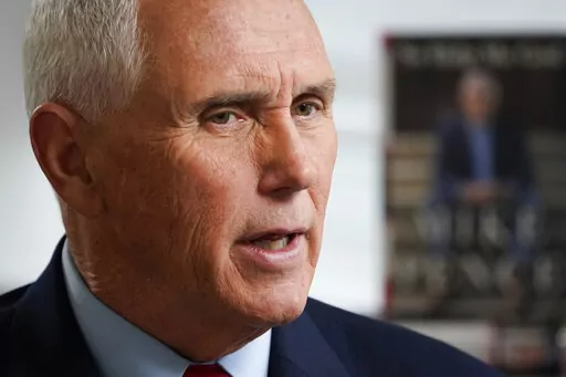Former Vice President Mike Pence sits for an interview with the Associated Press, Wednesday, Nov. 16, 2022, in New York. (AP Photo/John Minchillo)