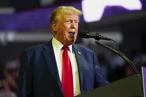 Republican presidential candidate former President Donald Trump speaks at a campaign rally, June 22, 2024, at Temple University in Philadelphia. The federal judge presiding over Trump's classified documents prosecution is hearing arguments Monday, June 24, on whether to bar him from public comments that prosecutors say could endanger the lives of FBI agents working on the case. Special counsel Jack Smith's team says the restrictions are necessary in light of Trump's false comments that the FBI a