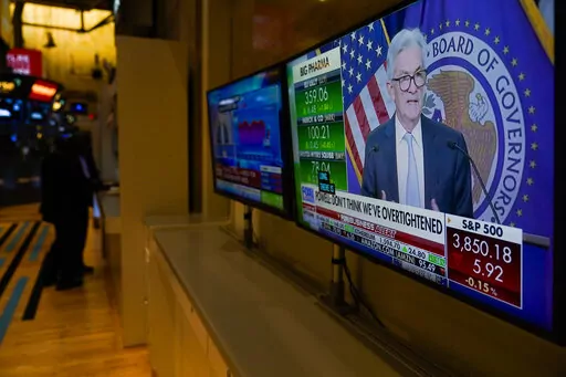 Traders work on the floor at the New York Stock Exchange as the Federal Reserve chairman Jerome Powell speaks after announcing a rate increase in New York, Wednesday, Nov. 2, 2022. (AP Photo/Seth Wenig)