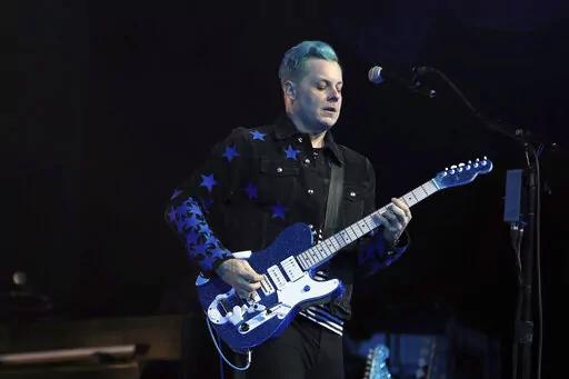 Jack White performs at the Masonic Temple Friday, April 8, 2022, in Detroit. White surprised fans by marrying musician Olivia Jean on stage during his Detroit homecoming show Friday. (Kirthmon F. Dozier /Detroit Free Press via AP)