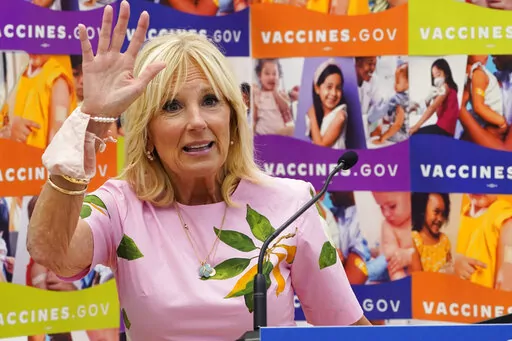 First lady Jill Biden waves as she speaks during a tour of a health facility, July 1, 2022, in Richmond, Va. Jill Biden is apologizing for saying Latinos are “as unique” as San Antonio breakfast tacos. Through a spokesperson, the first lady apologized Tuesday for “words that conveyed anything but pure admiration and love for the Latino community.”  Jill Biden was in San Antonio on Monday to address the annual conference of UnidosUS, a Latino civil rights and advocacy group. (AP Photo/Ste