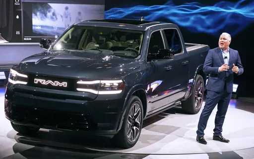 Mike Koval, RAM Brand Chief Executive Officer, introduces the REV Ram 1500 at the New York International Auto Show in New York Wednesday, April 5, 2023. (AP Photo/Craig Ruttle)