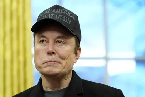Elon Musk listens during an event in the Oval Office with President Donald Trump at the White House, Tuesday, Feb. 11, 2025, in Washington. (Photo/Alex Brandon)