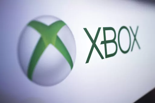 The Xbox logo is pictured at the Paris Games Week in Paris, Nov. 3, 2017. Microsoft's Xbox video game division on Tuesday, Feb. 21, 2023, announced new partnerships with Nintendo and chipmaker Nvidia as it tries to persuade European regulators to approve its planned $68.7 billion takeover of game publishing giant Activision Blizzard. (AP Photo/Kamil Zihnioglu, File)