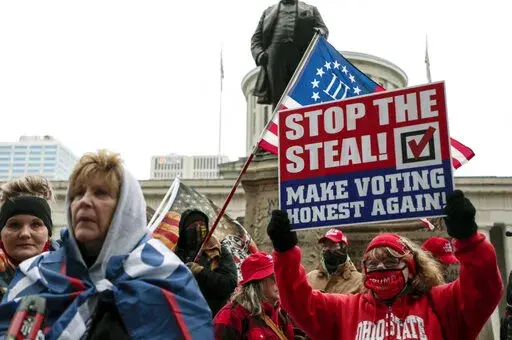Supporters of President Donald Trump demonstrate during a rally on, Jan. 6, 2021, at the Ohio Statehouse in Columbus, Ohio. This week’s gripping testimony about threats to election officials by former President Donald Trump and his followers had a rapt audience outside Washington -- secretaries of state and election clerks across the country who said the stories could very well have been their own.  (Joshua A. Bickel/The Columbus Dispatch via AP, File)