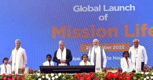 This photograph provided by India's Press Information Bureau shows U.N. Secretary General Antonio Guterres and Indian Prime Minister Narendra Modi at the launch of Mission Life, where “life” is an acronym for “lifestyle for environment,” in Kevadia, in the western Indian state of Gujarat, Thursday, Oct. 20, 2022. The Indian government’s flagship program to encourage individual and collective action on climate is designed to encourage individual behaviors like switching off vehicle engi
