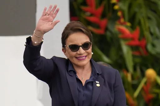 Honduras' President Xiomara Castro waves during the swearing-in ceremony for Colombia's President Gustavo Petro in Bogota, Colombia, Sunday, Aug. 7, 2022. Castro announced on Tuesday, March 14, 2023, that Honduras under her administration is opening diplomatic relations with the People´s Republic of China. (AP Photo/Fernando Vergara, File)