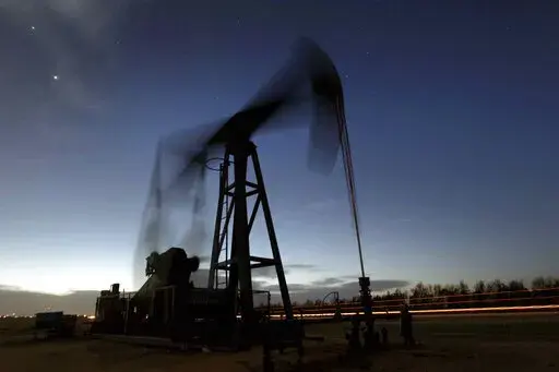 A pumping unit sucks oil from the ground near Greensburg, Kan. on March 6, 2012. The International Energy Agency says all 31 member countries have agreed to release 60 million barrels of oil from their strategic reserves “to send a strong message to oil markets” that there will be “no shortfall in supplies” as a result of Russia’s invasion of Ukraine. The IEA board made the decision Tuesday, march 1, 2022 at an extraordinary meeting of energy ministers chaired by U.S. Energy Secretary 