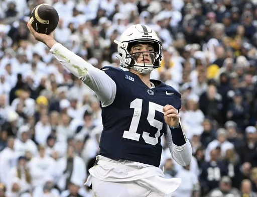 Penn State quarterback Drew Allar passes against Michigan during the second half of an NCAA college football game Nov. 11, 2023, in State College, Pa. Mississippi will play for the first 11-win season in school history when the Rebels of the Southeastern Conference, led by quarterback Jaxson Dart, face Penn State, led by Allar, in the Peach Bowl, Saturday, Dec. 30, 2023. (AP Photo/Barry Reeger, File)