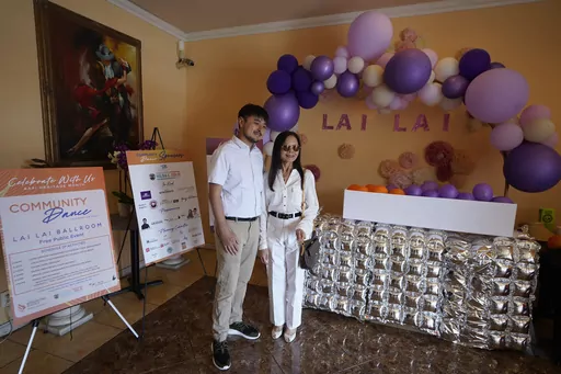 Lai Lai Ballroom and Studio founder Joyce Tsay, left, and her grandson and co-owner, Brandon Tsay, co-host a Community Dance to highlight the pride, strength, and resilience of the Asian American and Pacific Islander, AAPI, community at their ballroom in Alhambra, Calif., on Saturday, May 20, 2023. Brandon Tsay disarmed a mass shooter during Lunar New Year celebrations at his family's dance studio. (AP Photo/Damian Dovarganes)