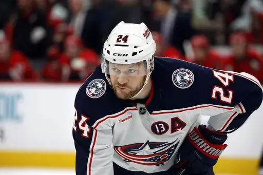 FILE -Columbus Blue Jackets' Mathieu Olivier (24) waits for a face-off against the Carolina Hurricanes during the first period of an NHL hockey game in Raleigh, N.C., Thursday, Jan. 23, 2025. (AP Photo/Karl DeBlaker, File)