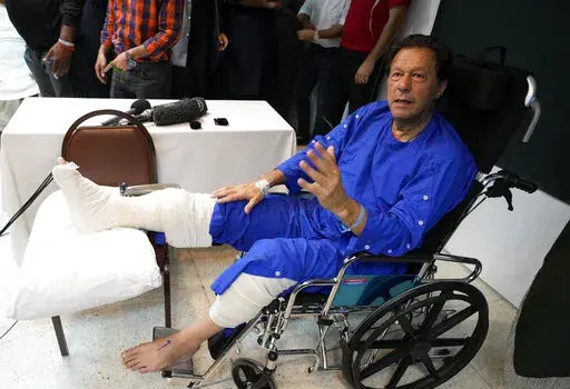 Former Pakistani Prime Minister Imran Khan speaks during a news conference in Shaukat Khanum hospital, where is being treated for a gunshot wound in Lahore, Pakistan, Friday, Nov. 4, 2022. Khan's protest march and rallies were peaceful until the afternoon attack on Thursday, when a gunman opened fire at his campaign truck. The shooting has raised concerns about growing political instability in Pakistan, a country with a history of political violence and assassinations.  (AP Photo/K.M. Chaudhry)