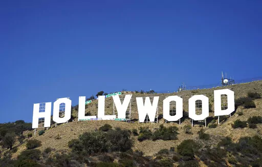 The Hollywood sign is pictured on Sept. 29, 2022, in Los Angeles. The Hollywood sign is getting a makeover befitting its status as a Tinseltown icon. After a pressure-wash and some rust removal, workers this week began using 250 gallons of primer and white paint to spruce up the sign ahead of its centennial next year. (AP Photo/Chris Pizzello, File)