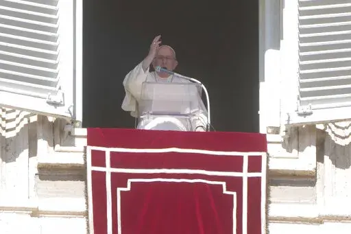 Pope Francis blesses the faithful from his studio's window overlooking St. Peter's Square on the occasion of the Angelus noon prayer at the Vatican, Sunday, Oct. 16, 2022.(AP Photo/Gregorio Borgia)