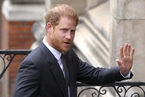 Britain's Prince Harry salutes media as he arrives at the Royal Courts of Justice in London, on March 30, 2023. Prince Harry is expected to return to the U.K. next month to attend a charity awards ceremony on the eve of the first anniversary of Queen Elizabeth II’s death. (AP Photo/Kirsty Wigglesworth, File)