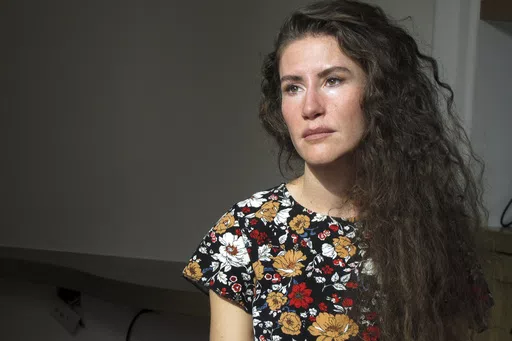 Chelsea Goodrich poses for a portrait at a friend's house in Ketchum, Idaho, on Tuesday, Sept. 19, 2023. Goodrich's father, a popular Idaho dentist and former bishop in The Church of Jesus Christ of Latter-day Saints, widely known as the Mormon church, was excommunicated after sharing details about his relationship with her when she was a child during a religious confession. Recordings obtained by The Associated Press show that instead of helping prosecutors, the church used a legal playbook tha