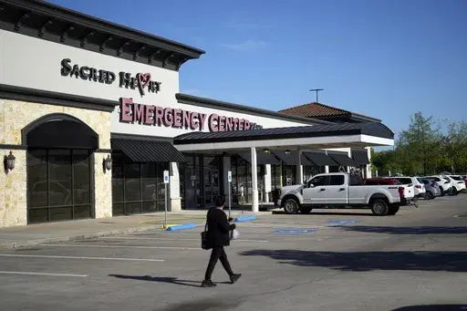 Sacred Heart Emergency Center is pictured Friday, March 29, 2024, in Houston. Complaints about pregnant women being turned away from emergency rooms spiked in the months after states began enacting strict abortion laws following the 2022 U.S. Supreme Court decision overturning Roe v. Wade. At Sacred Heart Emergency Center in Houston, front desk staff refused to check-in one woman after her husband asked for help delivering her baby. She miscarried in a restroom toilet in the emergency room lobby